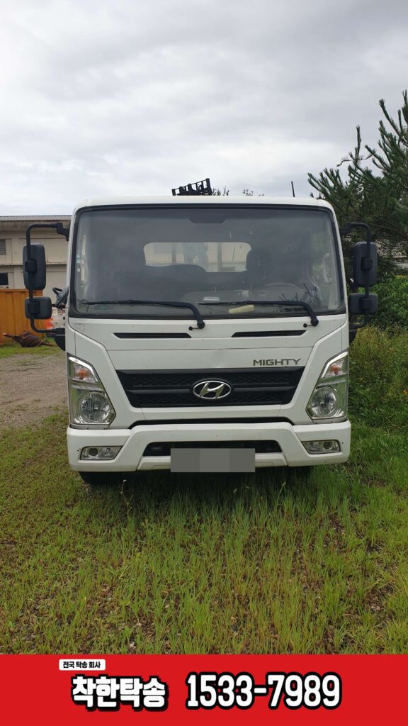 충주에서 평택까지 이동식 컨테이너가 적재된 3.5톤 카고트럭 작업차량을 안전하게 탁송한 현장 사진